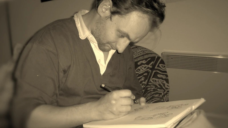Photo de Alex en train de dessiner