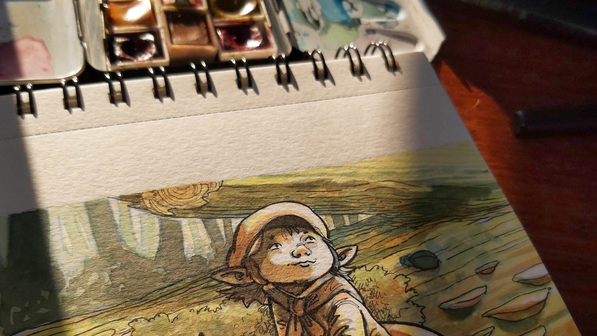 Illustration de lutin avec une boite d'aquarelle
